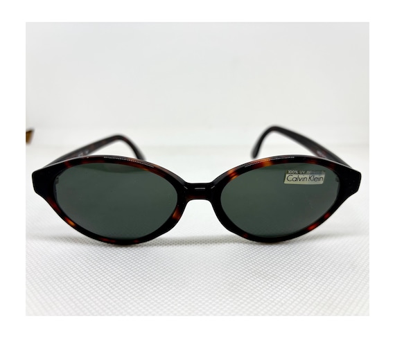 Calvin Klein Small Oval Sunglasses Calvin Klein 1010 Oval Silver Metal Sunglasses W Black Cello  main image 2