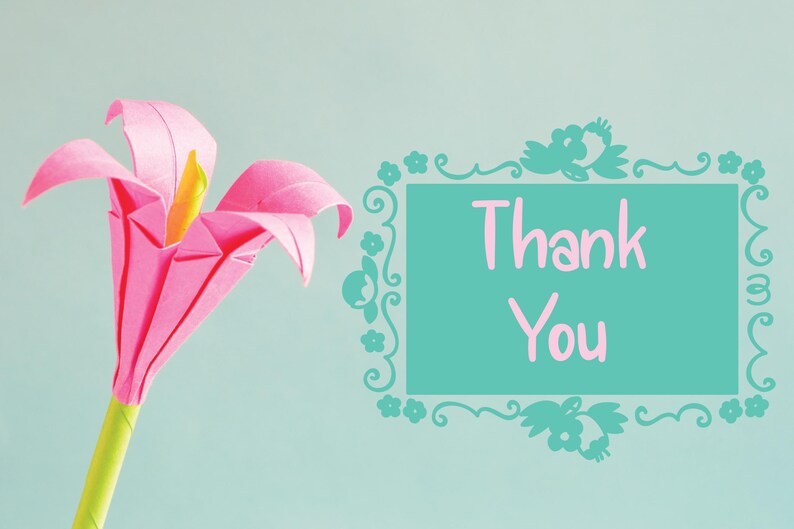 May include: A pink origami flower with a yellow center and green stem. The flower is set against a light blue background. A teal frame with the words "Thank You" in pink is on the right.