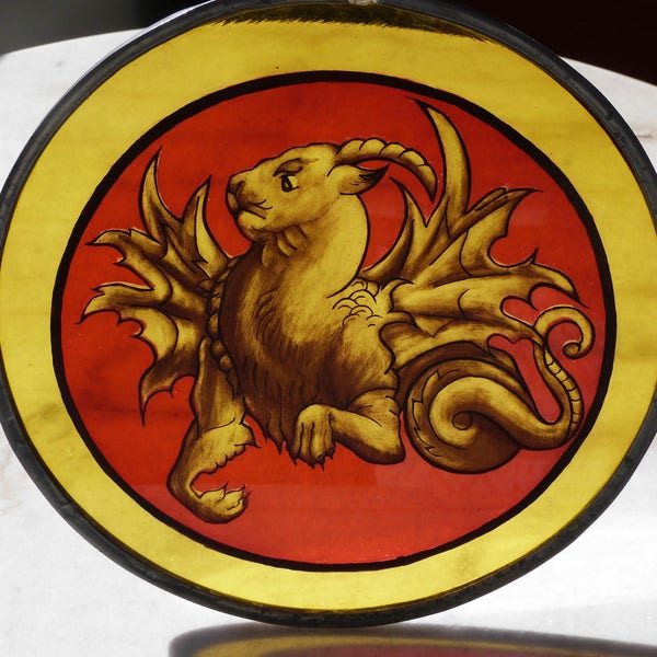vitrail peinture sur verre lion dragonné jaune