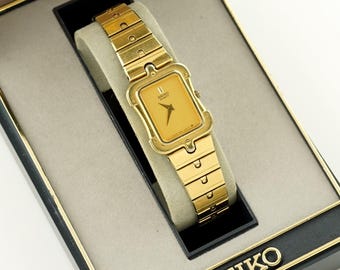 Rare Ladies Seiko Rectangular Gold Watch in original box, womens tank wristwatch