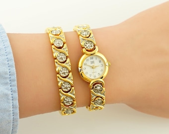 Zegarek na rękę Carvel Vintage Double Bracelet: Złoty zegarek na rękę z kwiatowym wzorem