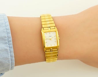 Montre vintage HermÃ¨s PanthÃ¨re fine dorÃ©e - nÃ©cessite une pile