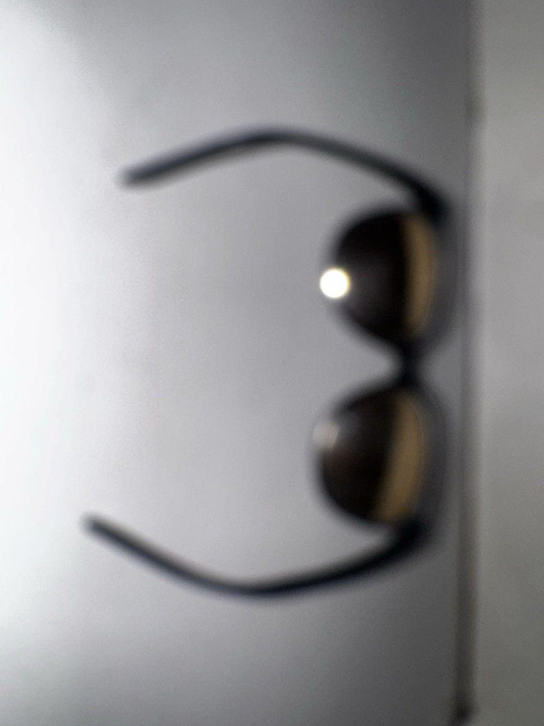 Gafas de sol Ray-Ban Bausch & Lomb France estilo ojo de gato vintage, color negro y plateado con efecto espejo. imagen 6