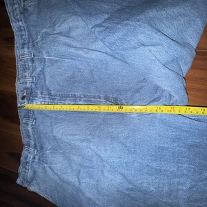 Pantalones vaqueros Wrangler Rugged Wear Angler talla 52x32 con cintura elástica y pliegues grandes. imagen 8