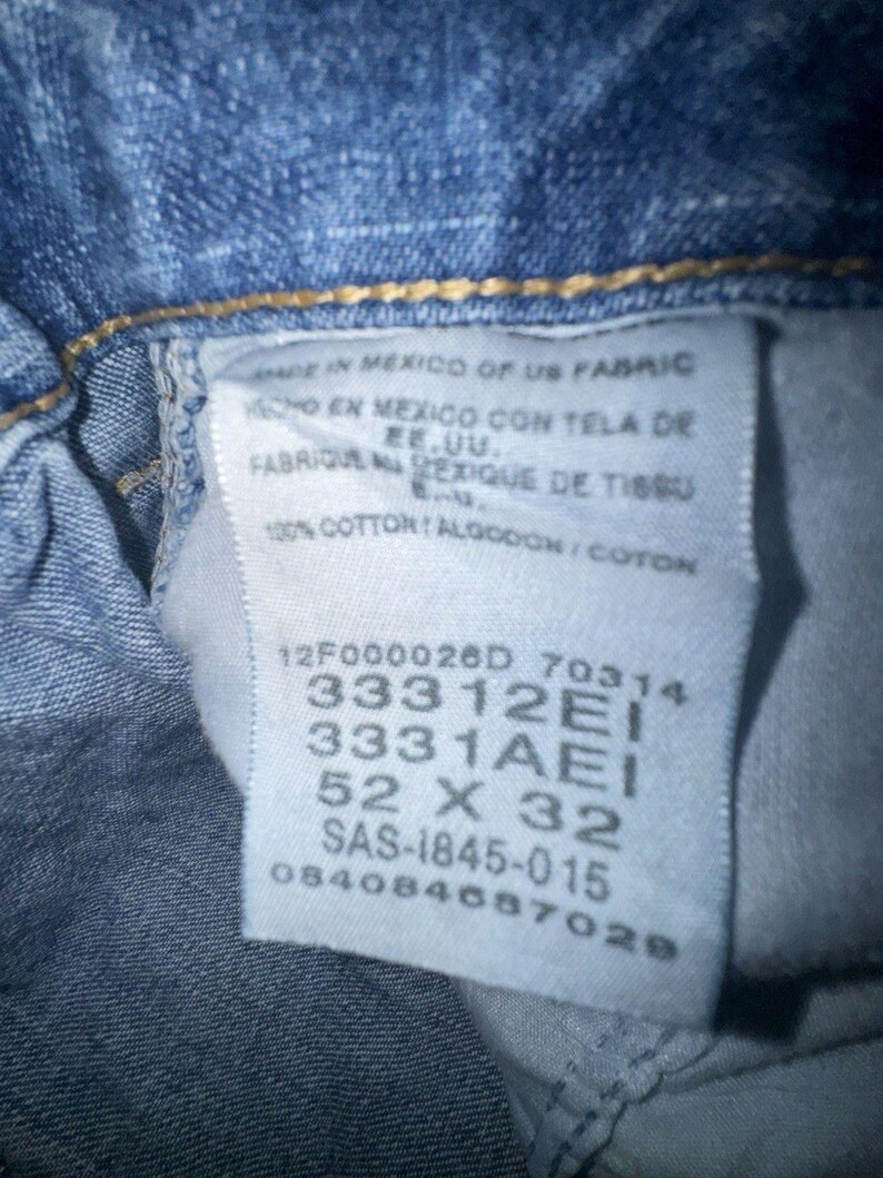 Pantalones vaqueros Wrangler Rugged Wear Angler talla 52x32 con cintura elástica y pliegues grandes. imagen 11
