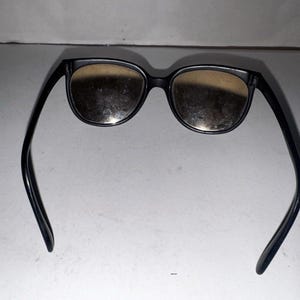 Gafas de sol Ray-Ban Bausch & Lomb France estilo ojo de gato vintage, color negro y plateado con efecto espejo. imagen 7