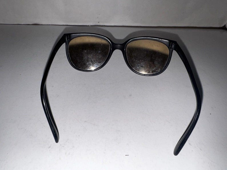Gafas de sol Ray-Ban Bausch & Lomb France estilo ojo de gato vintage, color negro y plateado con efecto espejo. imagen 7