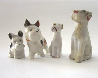 Set of Four Porcelain Miniature Vintage Dogs, Three Terriers and a Hound