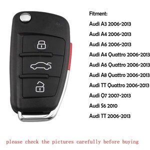 May include: Black car key fob with four buttons. The buttons have icons for lock, unlock, trunk, and a car silhouette. The key fob has a red accent on the side. The text "Fitment:" is listed with a list of Audi models and years.