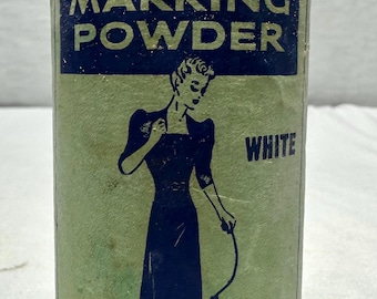 May include: A vintage Collins Special Marking Powder container. The cylindrical container has a blue and green label with the text "Special Marking Powder" and an illustration of a woman. The word "White" is also visible.