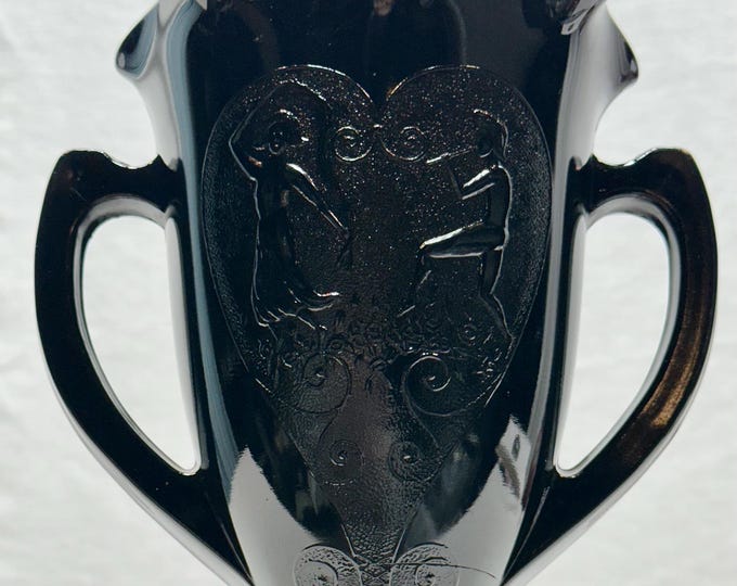 Antique Black Glass Two Handled Pedestal Vase with Embossed Dancing Couple