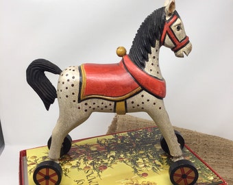vintage wooden horse on wheels