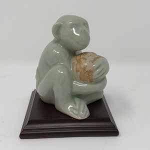 Vintage Celedon Crackled Glazed Monkey Figure -Presented on a wooden display stand that is 4 inches wide. -from Thailand- signed