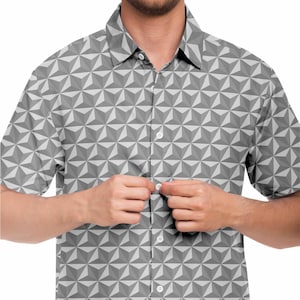 May include: A gray short-sleeved button-down shirt with a geometric pattern.
