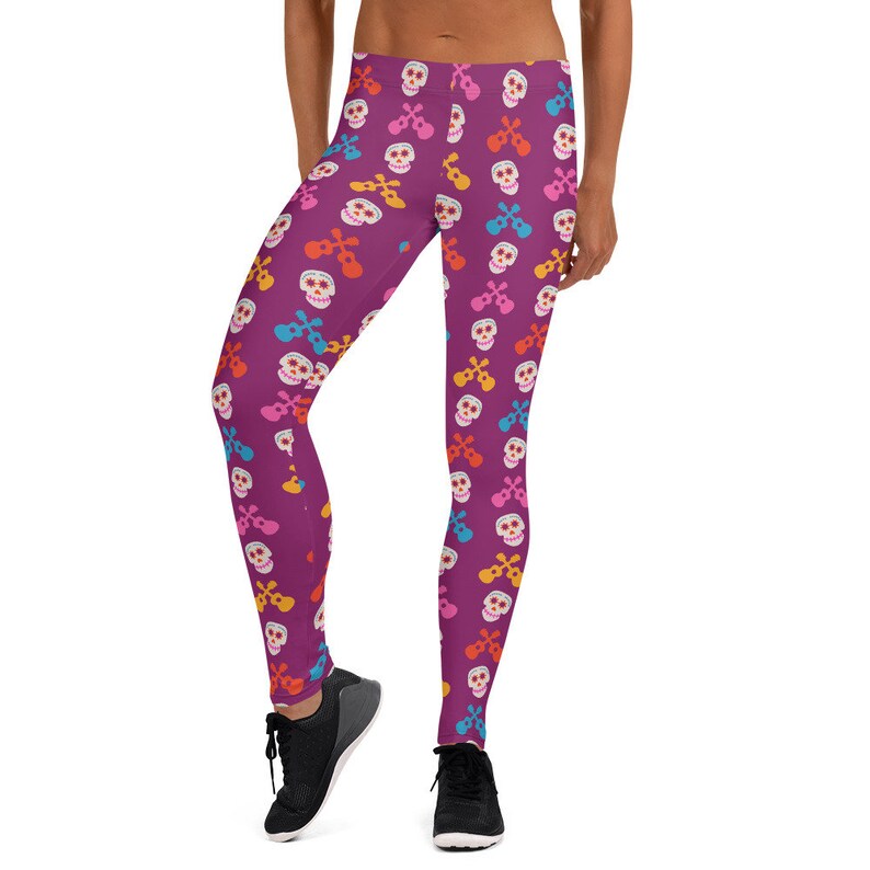 May include: Purple leggings with a colorful skull and ukulele pattern.