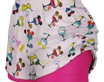 May include: White athletic shorts with a colorful pattern of wine glasses with mouse ears and floral accents. The shorts have a built-in hot pink liner and an elastic waistband.