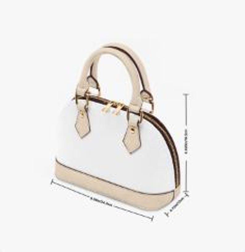 May include: White dome-shaped handbag with beige trim and handles. The bag features a gold zipper and hardware. Dimensions are approximately 9.65 inches (24.5 cm) wide, 7.09 inches (18 cm) high, and 4.72 inches (12 cm) deep.