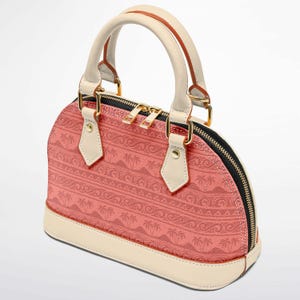 May include: A coral-colored dome-shaped handbag with a cream-colored base, handles, and accents. The bag features a repeating pattern of palm trees and waves. Gold-toned hardware and a black zipper complete the design.