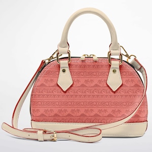 May include: A coral-colored dome handbag with a cream-colored handle and accents. The bag features a repeating pattern and a detachable shoulder strap. Gold-colored hardware adds a touch of elegance to this stylish accessory.