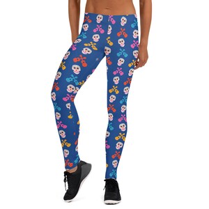 May include: Blue leggings with a colorful skull and ukulele pattern.