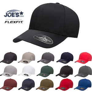 May include: A collection of 15 black, navy, red, green, white, and gray baseball caps with a Flexfit logo. The caps are all the same style, with a curved brim and a mesh back.
