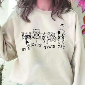 Funny French Cats Hilarious Cat Apparel Quirky Kitty Clothing French Feline Humor Gifts Counting Un Deux Trois Cat French Cat Sweatshirt