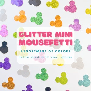 May include: Assortment of colorful glitter mouse confetti.  The confetti is shaped like Mickey Mouse heads.  The text on the image reads "Glitter Mini Mousefetti Assortment of Colors Petite sized to fit small spaces".