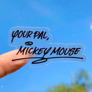 May include: A clear sticker with black text that reads "Your Pal, Mickey Mouse".