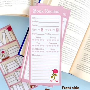 May include: Pink book review bookmarks with prompts for detailed tracking. Each bookmark features spaces for title, author, genre, and rating, with a rose illustration. The text "Book Review" is at the top.