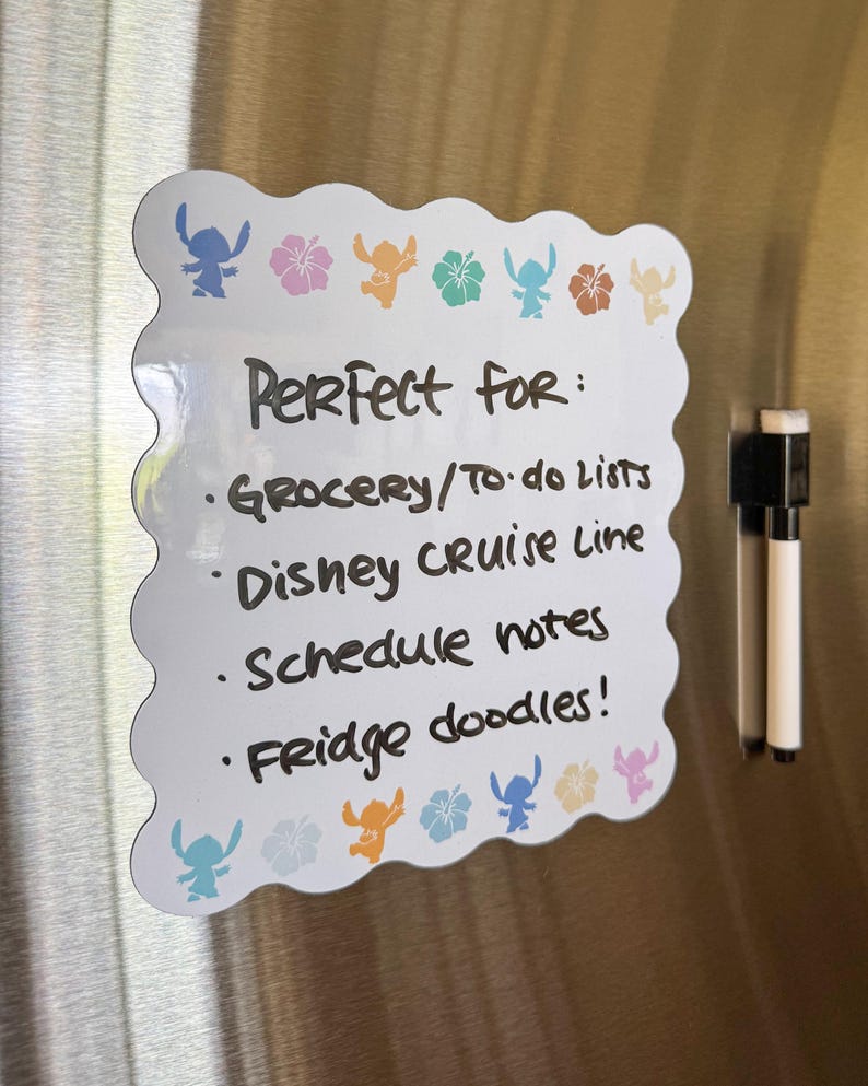 May include: White, scalloped-edge dry-erase board with Stitch and flower graphics. Text reads "Perfect for: Grocery/To-do Lists, Disney Cruise Line, Schedule notes, Fridge doodles!" A black and white marker is attached.