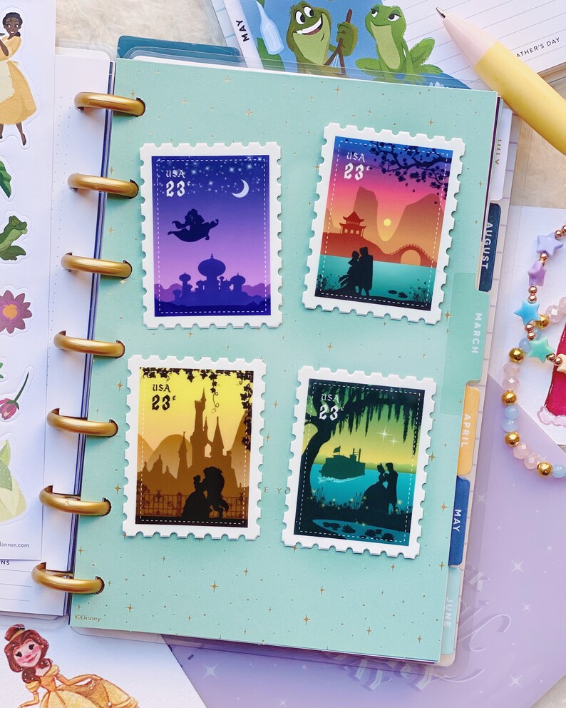 May include: Four colourful postage stamps featuring silhouettes of Disney couples from different animated films. The stamps are arranged in a grid on a light blue background with a white star pattern. The stamps feature the text "USA 23&cent;".
