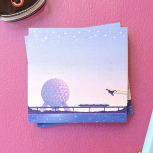 May include: A square sticky note featuring a gradient sky from light blue to soft pink, depicting a large geodesic sphere, a monorail train on a track, and a silhouette of a flying dragon leaving a rainbow trail above a dark blue water surface.