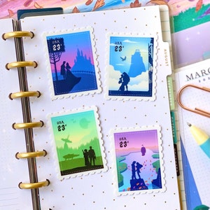 May include: Four colourful postage stamps each featuring a silhouette of a couple. The stamps are decorated with a castle, a spaceship, a mountain, and a lake. Each stamp says "USA 23&cent;".