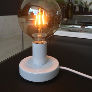 White metal table lamp with white textile cable and switch