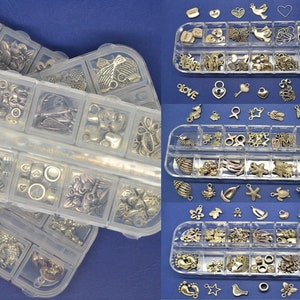 assortment beads and charms, silver metal, children&#39;s kit, plastic box storage