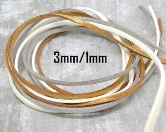 May include: A close-up of four spools of cord, each 3mm wide and 1mm thick. The cords are in the colours gold, white, silver, and grey.