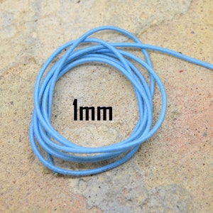 May include: A coil of light blue elastic cord, 1 mm in diameter.