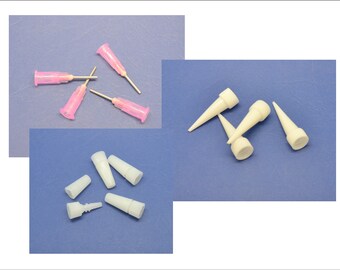 May include: A set of five pink and white plastic dispensing tips for glue, epoxy, or other adhesives. The tips are designed for precision application and come in a variety of sizes.