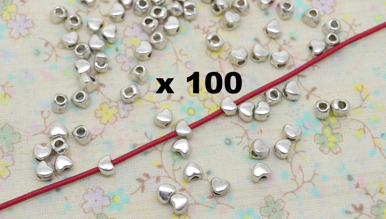 20 ou 100 perles coeur, en métal argenté, trou 1mm image 1