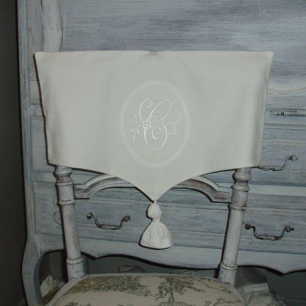 Cover of folder old chair, Monogram medallion and tassel