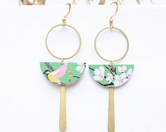Mismatched earrings featuring a titmouse bird and cherry blossoms in a half-moon circle, asymmetrical Japanese pattern on a green background – a gift for her