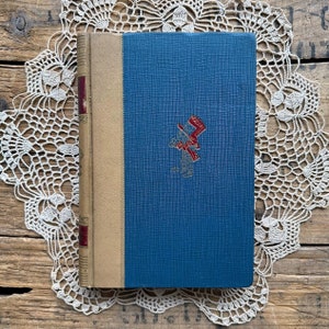 Vintage Alice&#39;s Adventures in Wonderland and Through the Looking Glass book by Lewis Carroll, mad hatter tea party, cheshire cat