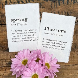 Flowers and spring definition prints in typewriter font on handmade cotton paper. Spring is a lovely reminder of how beautiful change can be, a season of renewal and growth, and a whimsical time of year.