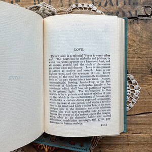 May include: A close-up of a page from a vintage book with the title "Love." The text discusses the concept of love as a universal force that is present in nature and in the human soul. The text also mentions the importance of love in relationships and its role in creating a sense of happiness and fulfilment.