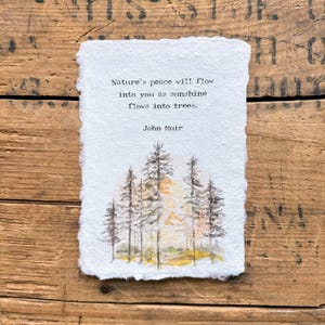 May include: A watercolor painting of a forest with a quote by John Muir: "Nature's peace will flow into you as sunshine flows into trees."