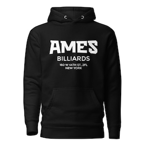 May include: Black hoodie with white text that reads "AMES BILLIARDS" above the address "160 W 44TH ST, 2FL NEW YORK". The hoodie has a drawstring hood and a front pocket.