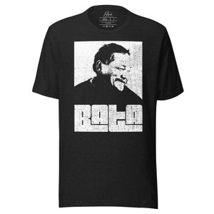May include: Black t-shirt with a white graphic of a man's face and the word "BALA" in a distressed font.
