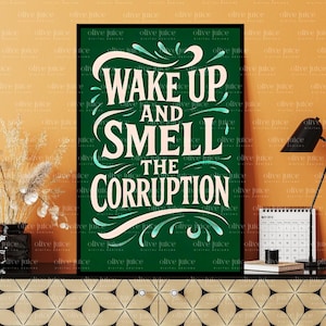 May include: A framed art print with the text "WAKE UP AND SMELL THE CORRUPTION" in white and teal script on a dark green background. The print is displayed on a black surface with a desk lamp, calendar, and decorative vase.