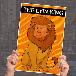 May include: A poster with the text "THE LYIN KING" above a cartoon lion with the face of a man. The lion is orange and tan, set against an orange and yellow striped background.