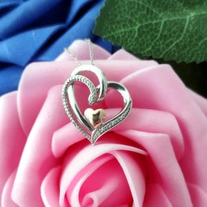 Sterling Silver Diamond Heart with 18&quot; Silver chain. 925 Sterling Silver Diamond Heart with 18&quot; chain. Diamond heart charm with gold accent
